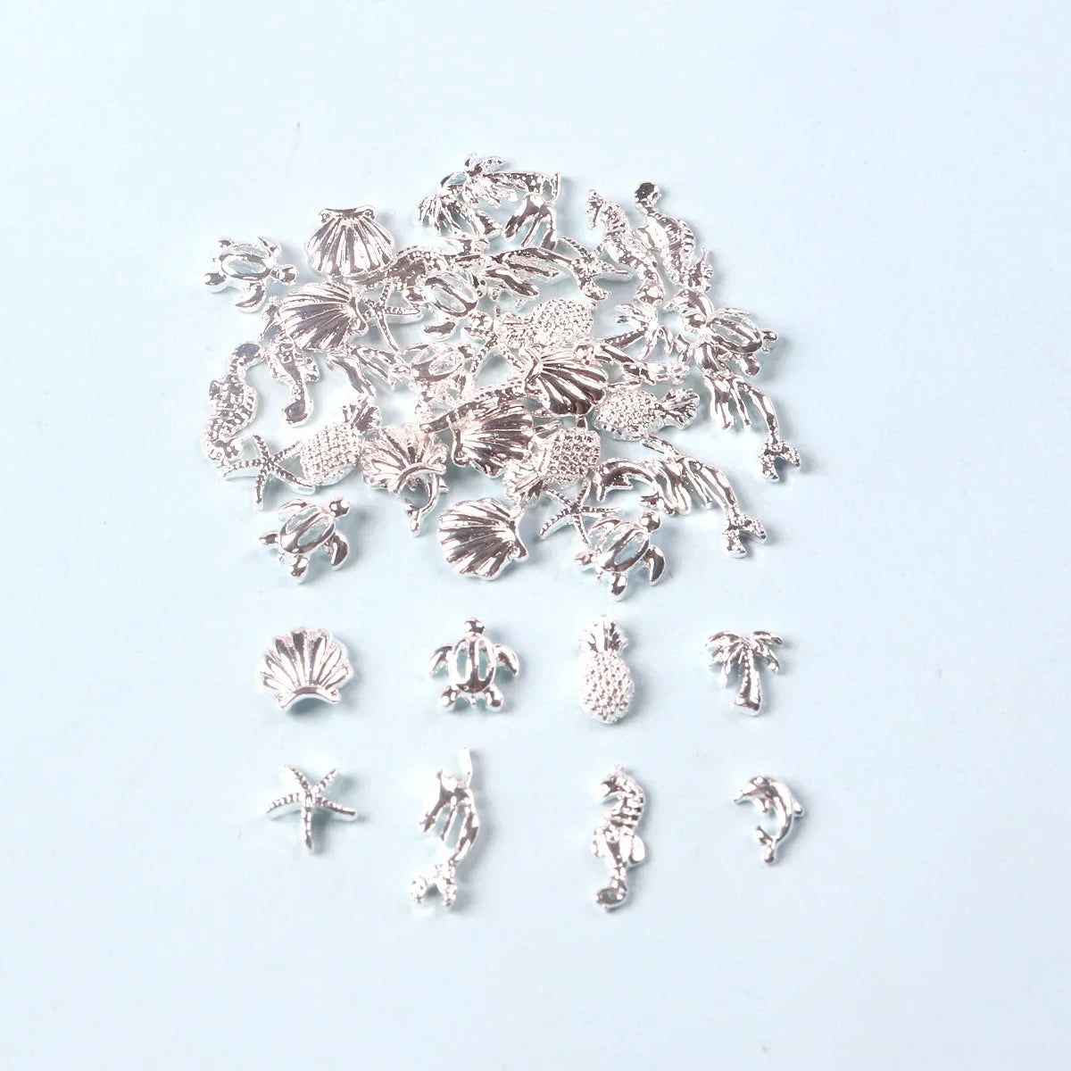 TSZS 50pcs/bag Ocean Starfish Shell Nail Art Charms Silver Beach Starfish Sea Seashell Nail Decoration Metal 3D Charms for Nail